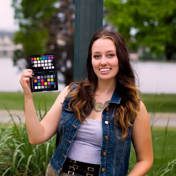 Model holding a color checker