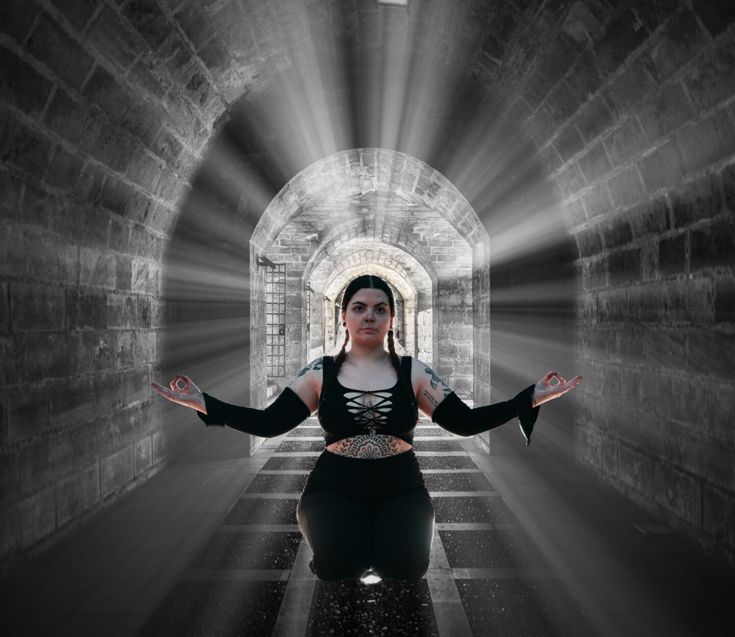 streams of sunlight around a model in black