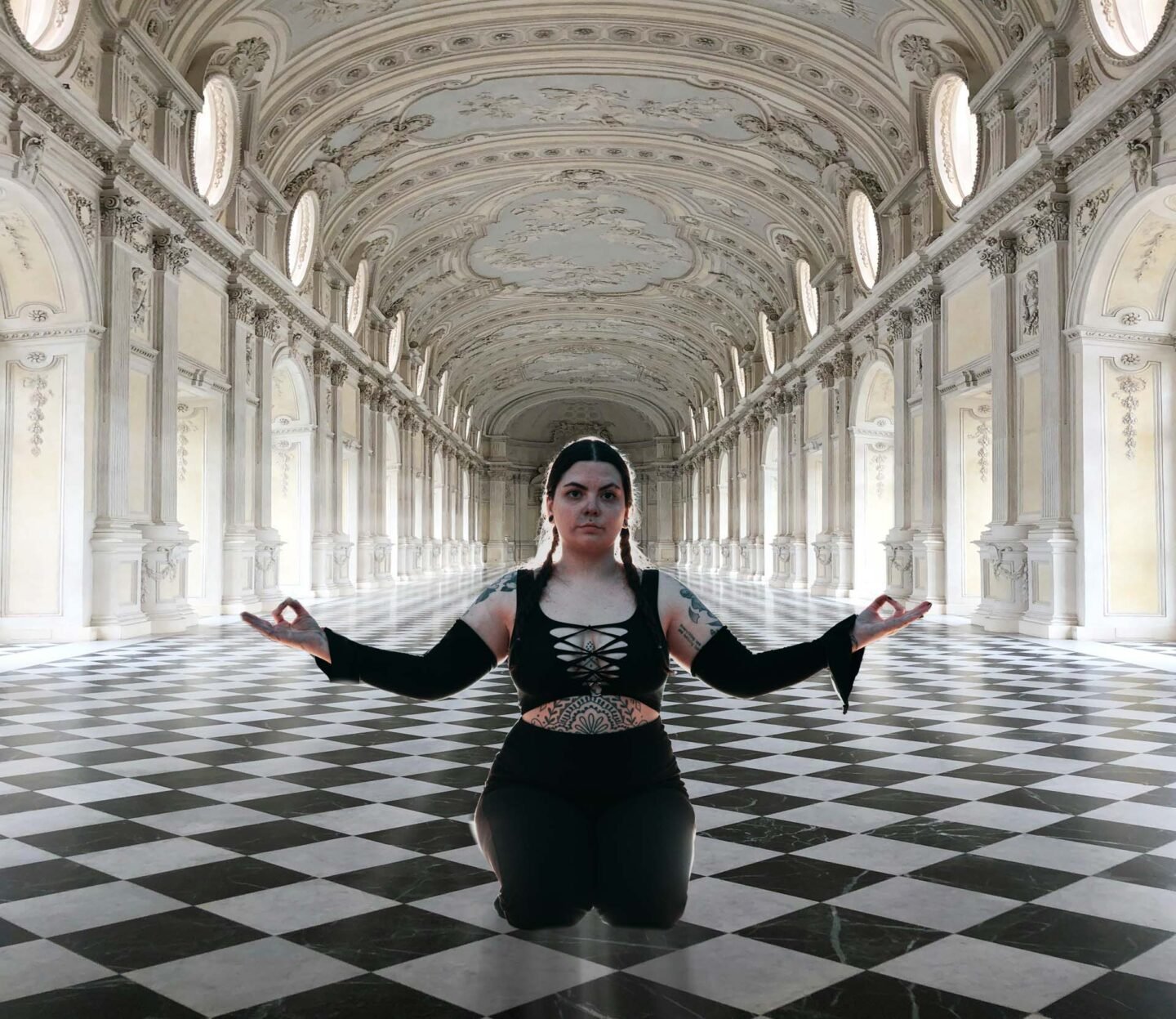 model posing on a checkerboard floor