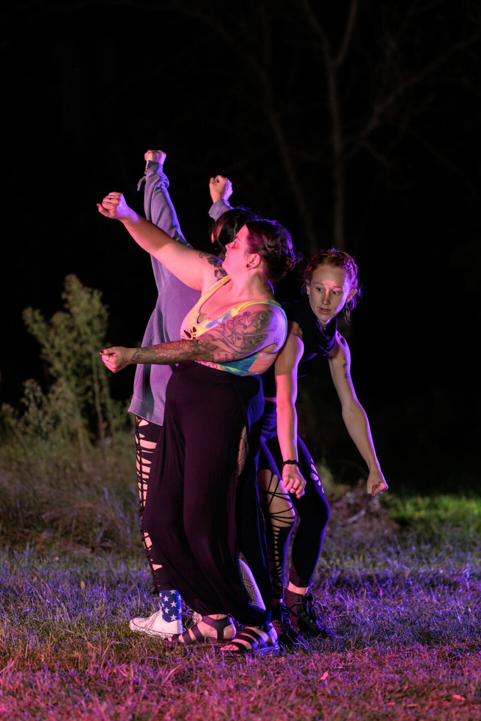 night portrait with fire and flow - 
Three dancing fire flow artists
