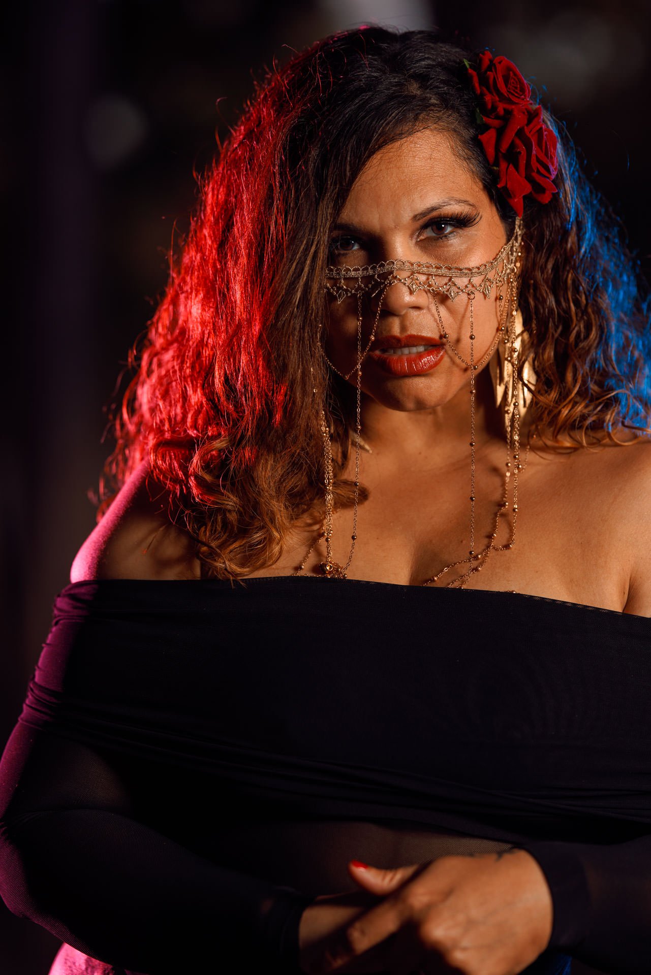 Woman in black dress in night time portrait