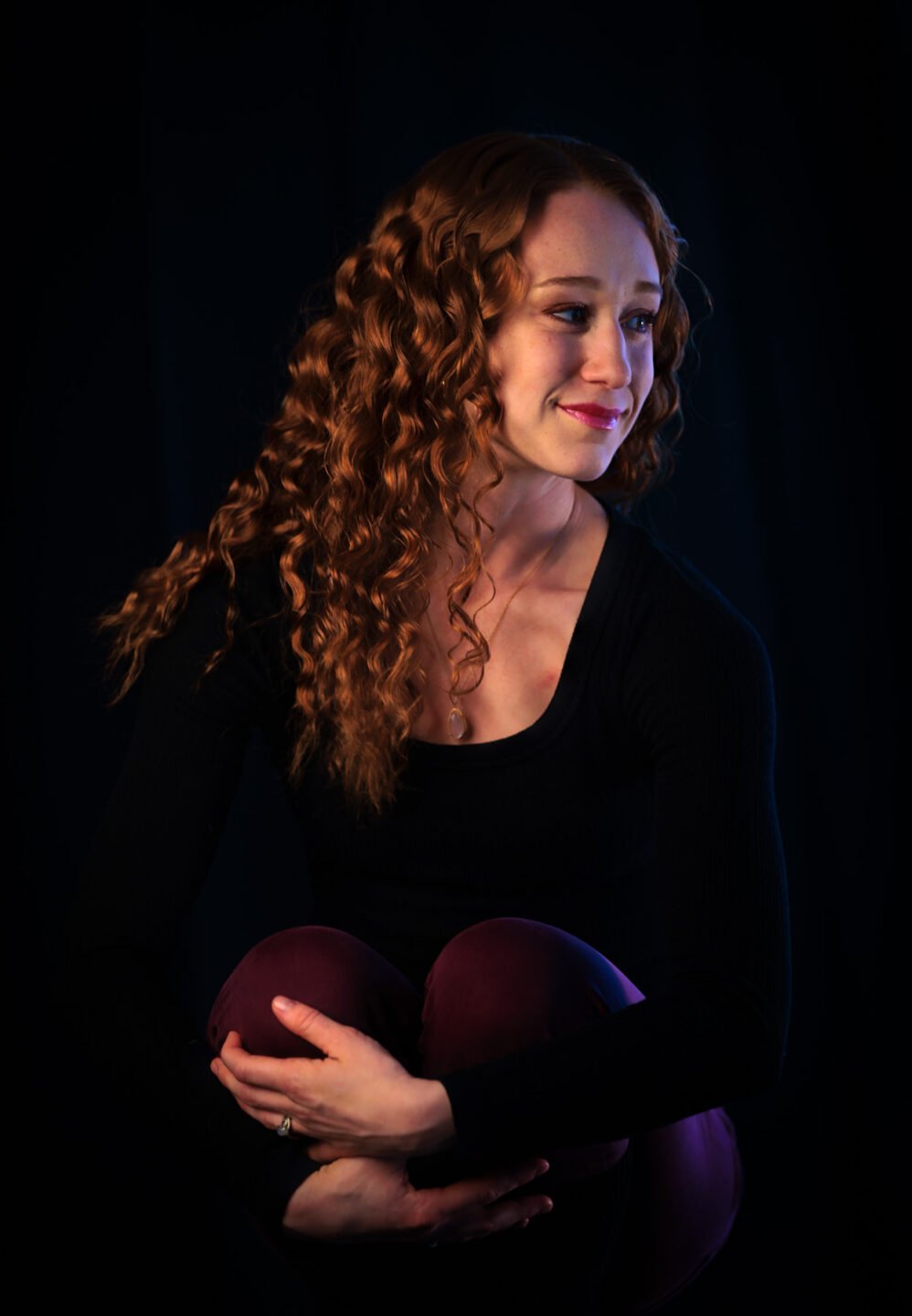 Head shot portrait of a woman in black